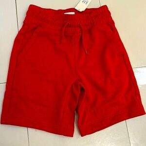 Gap burnt orange cotton/poly knit shorts. Pockets. Elastic waist.Size 4-5 XS NWT